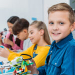 boy-showing-colorful-robot-during-stem-robotics-le-2022-12-16-15-35-22-utc-1.jpg